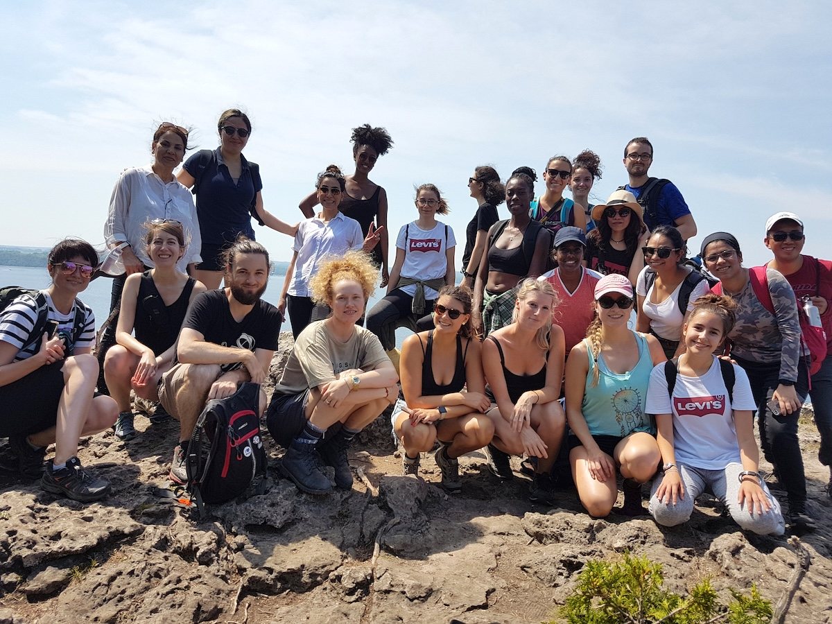 A big group of friends on a rocky lookout above Georgian Bay